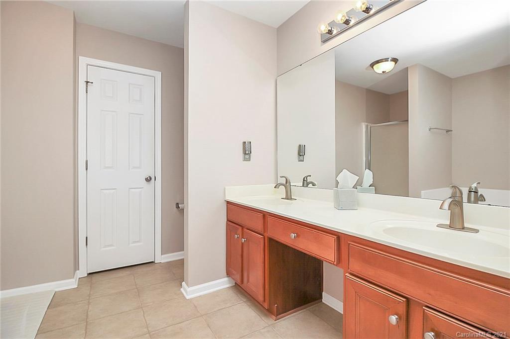 2139 Midnight Blue Lane Fort Mill, SC 29708 - Photo 15 of 23 a bathroom with a sink and a mirror