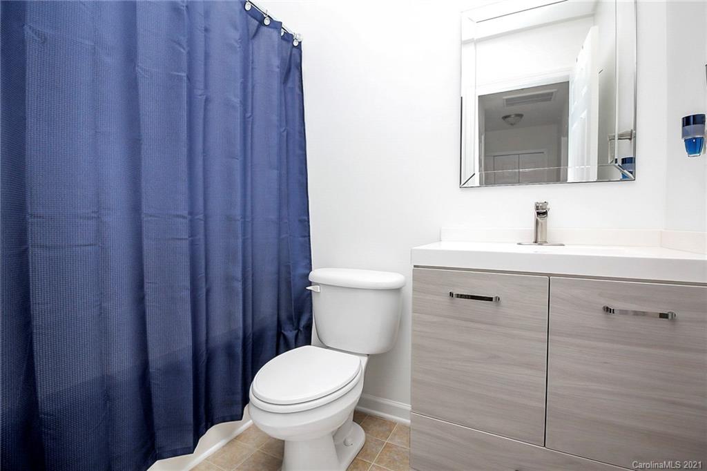 2139 Midnight Blue Lane Fort Mill, SC 29708 - Photo 18 of 23 a bathroom with a sink vanity and a toilet