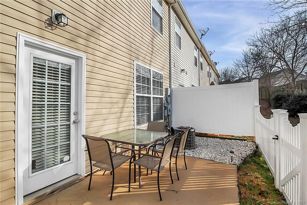 2139 Midnight Blue Lane Fort Mill, SC 29708 - Photo 20 of 23 a patio with table and chairs and potted plants