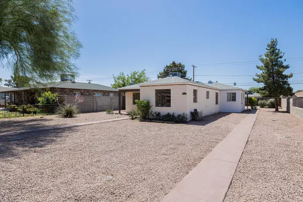 front view of a house with a yard