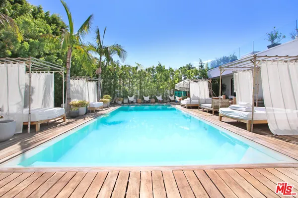 a view of a swimming pool with a lounge chairs