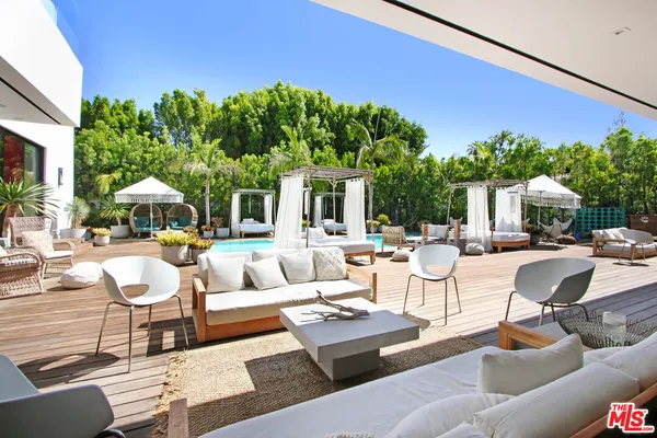 a view of swimming pool with sitting area