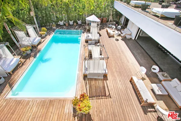 a view of a backyard with sitting area