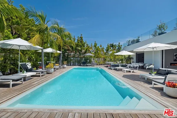 a view of a swimming pool with a patio