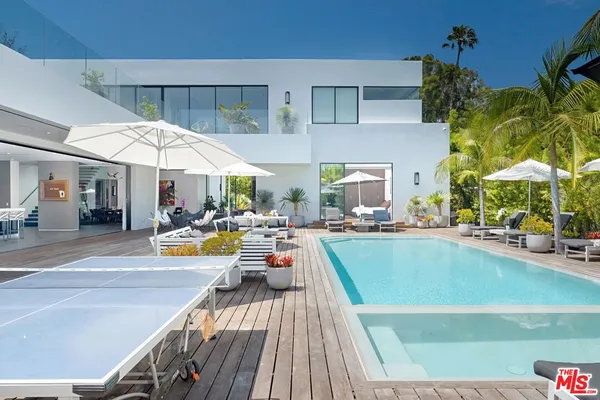 a view of swimming pool with chairs