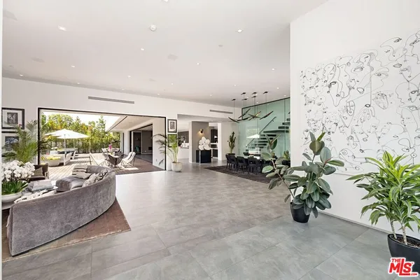 a view of living room with furniture and potted plant