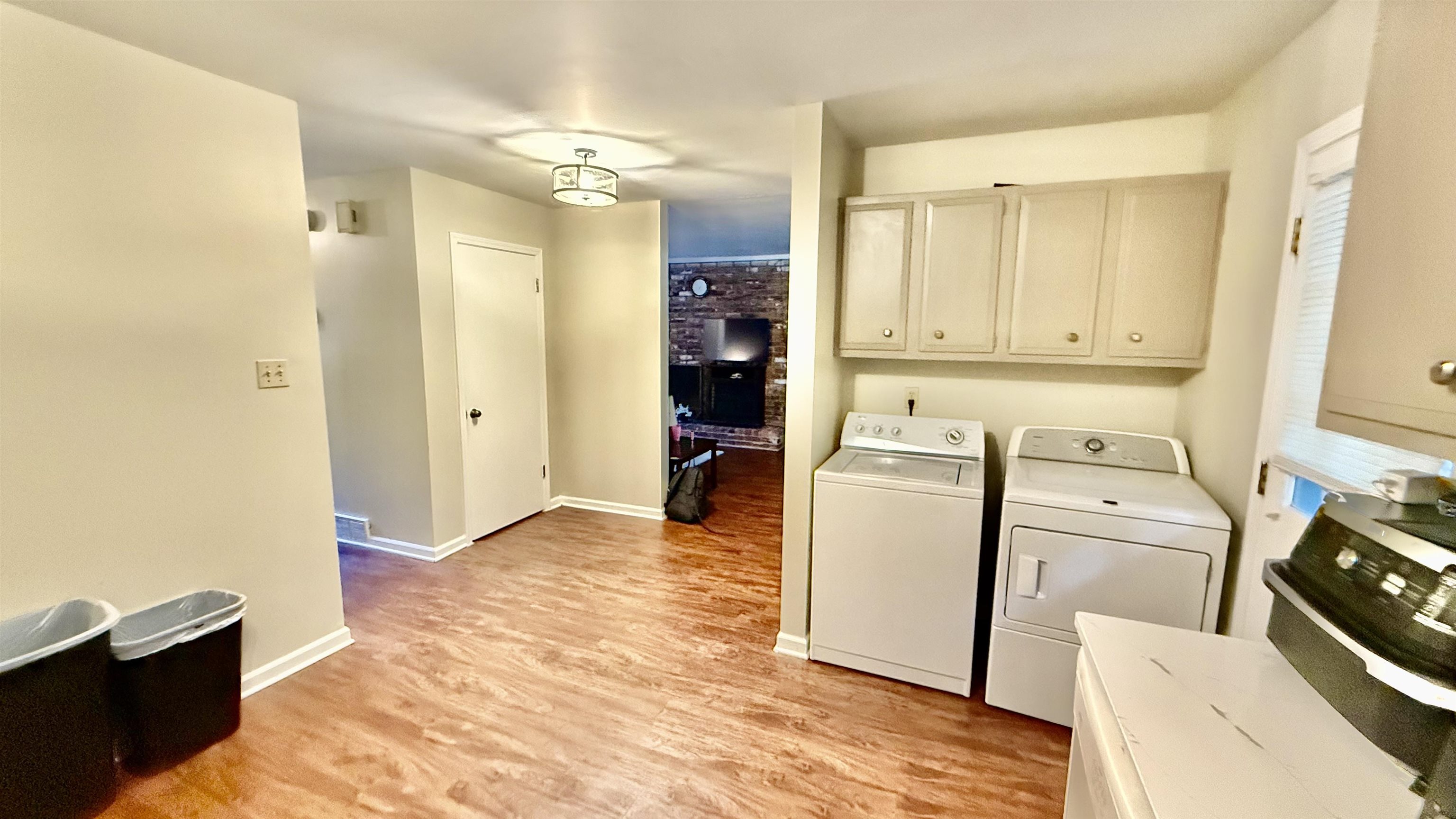 379 Dove Valley Road Collierville, TN 38017 - Photo 4 of 12 Washroom with washer and clothes dryer, light wood finished floors, and baseboards