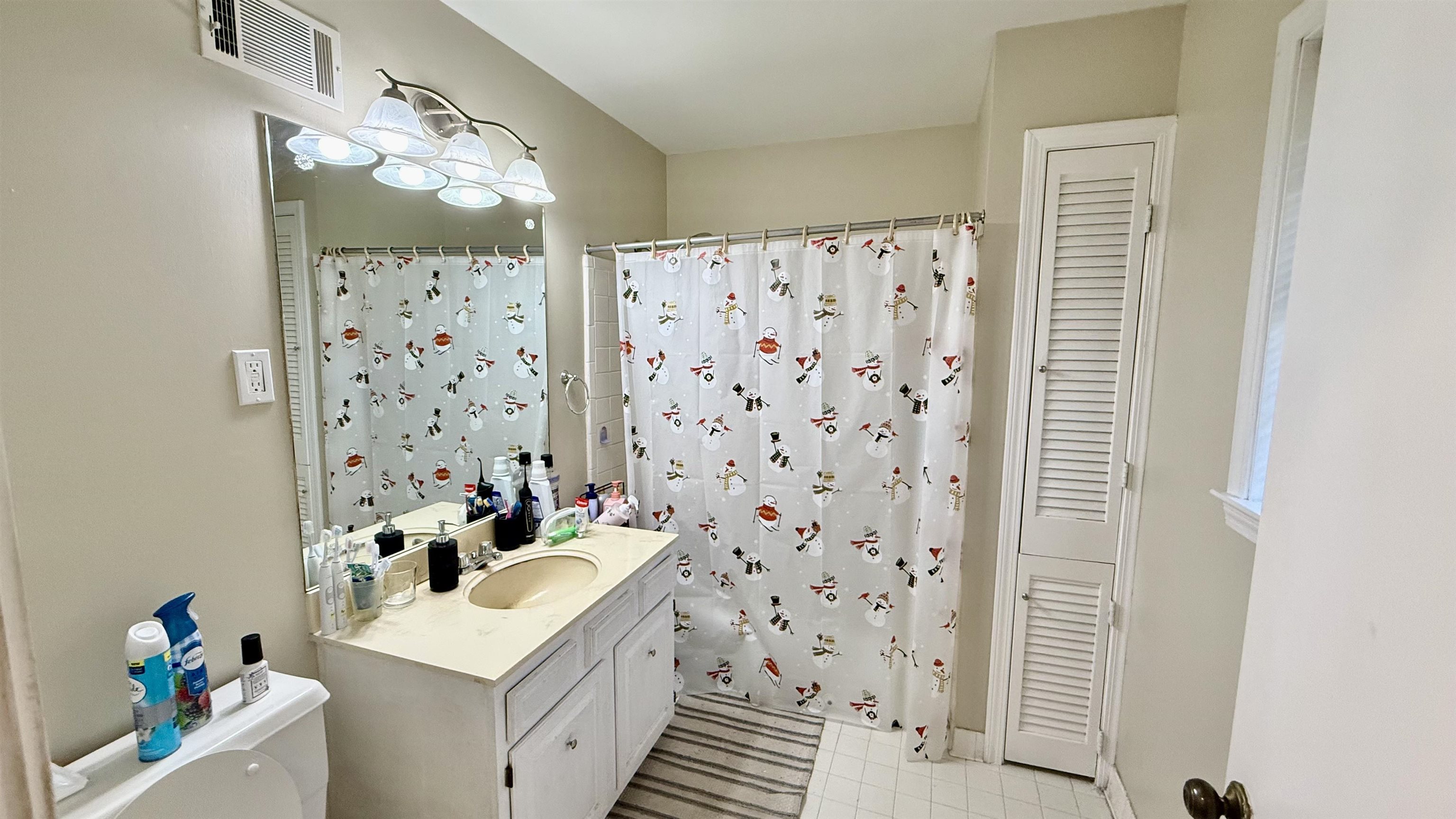 379 Dove Valley Road Collierville, TN 38017 - Photo 7 of 12 Bathroom featuring toilet, vanity, and curtained shower