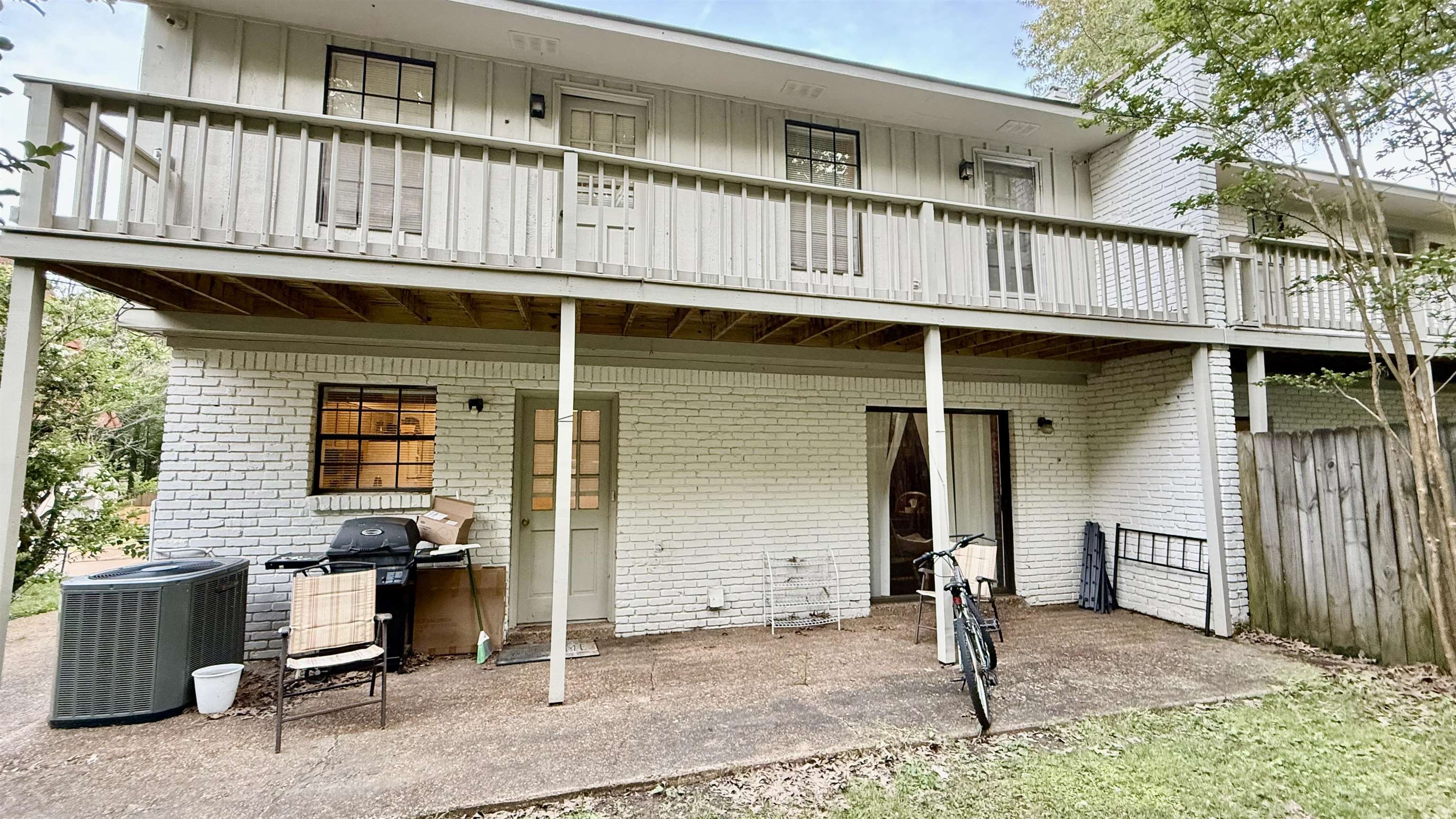 379 Dove Valley Road Collierville, TN 38017 - Photo 9 of 12 Back of house with central AC unit, brick siding, fence, and a balcony