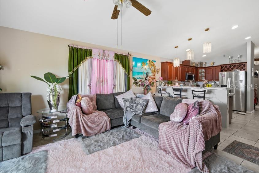 3005 West Chestnut Street Tampa, FL 33607 - Photo 13 of 27 a living room with furniture and a chandelier