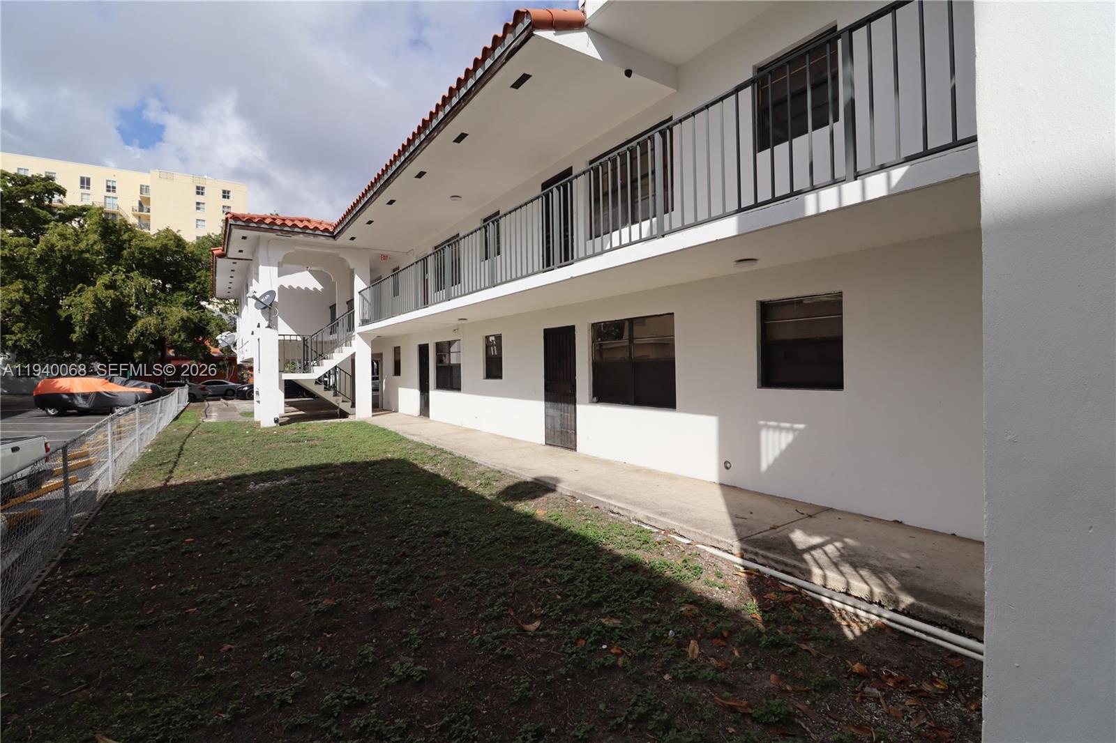 1348 Southwest 2nd Street, Unit 8 Miami, FL 33135 - Photo 13 of 37 a front view of a house with a yard