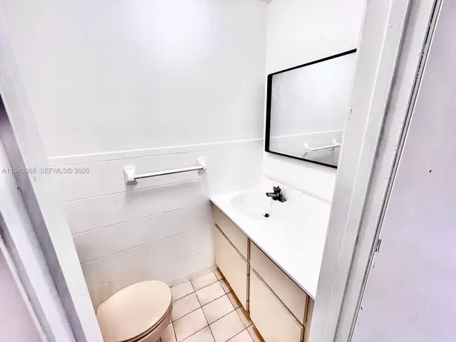 a bathroom with a bathtub and toilet