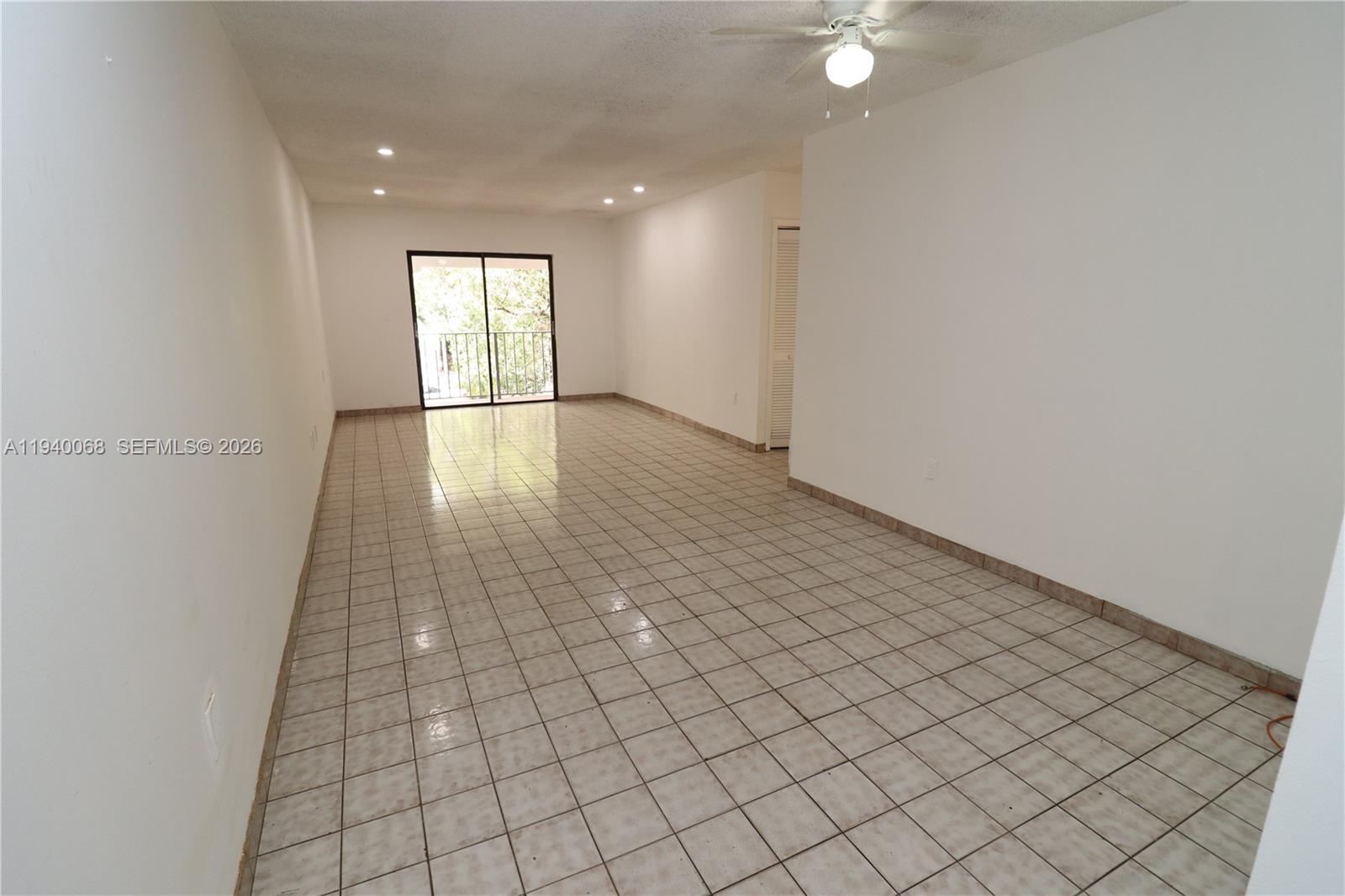 1348 Southwest 2nd Street, Unit 8 Miami, FL 33135 - Photo 23 of 37 an empty room with wooden floor and windows