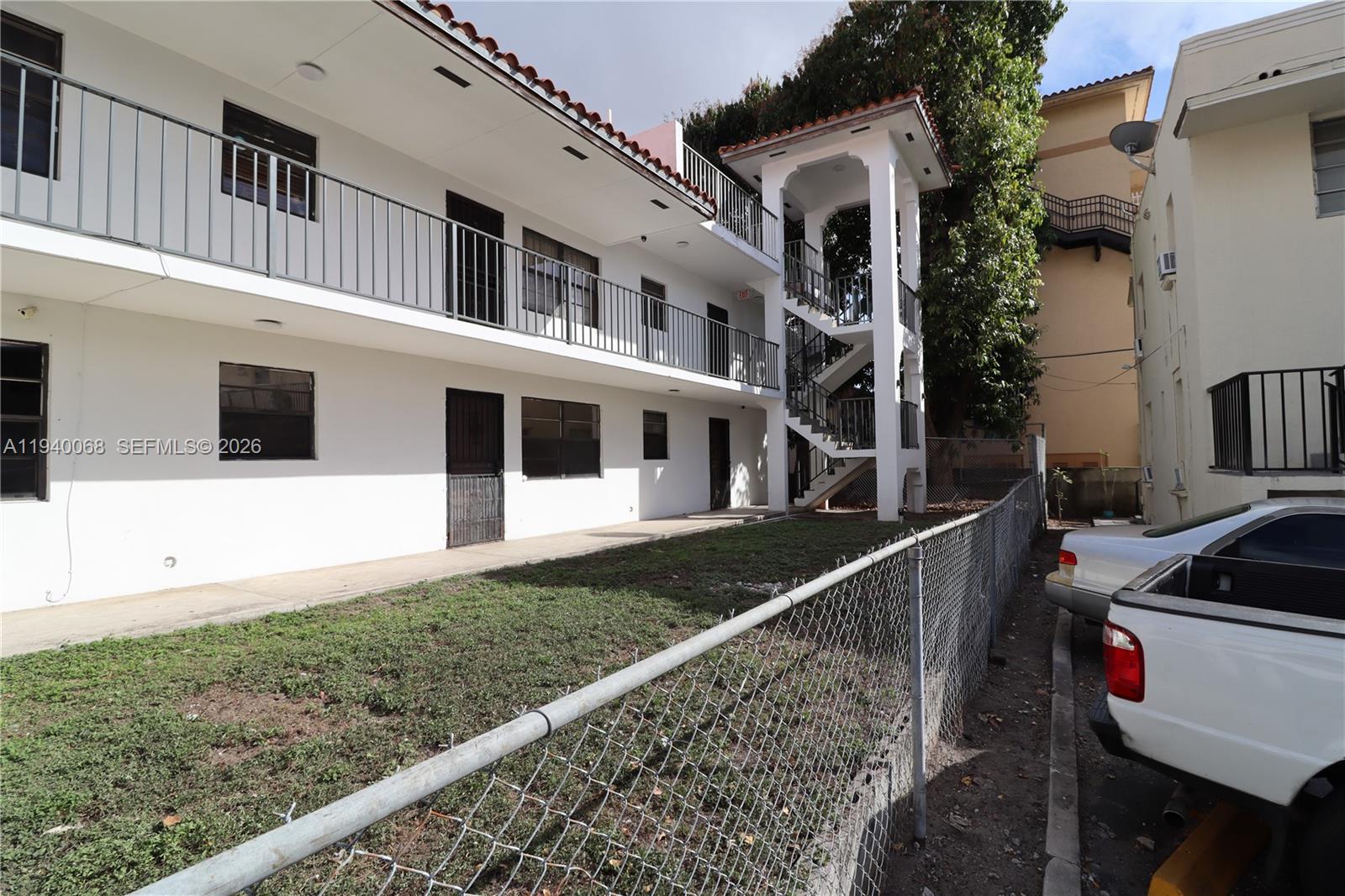 1348 Southwest 2nd Street, Unit 8 Miami, FL 33135 - Photo 28 of 37 a view of a house with many window