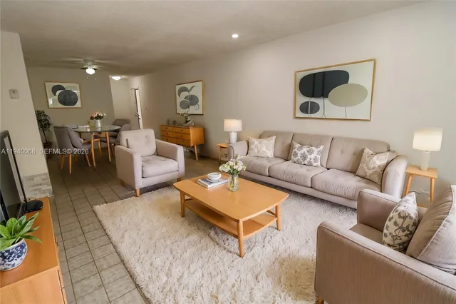 a living room with furniture and a rug
