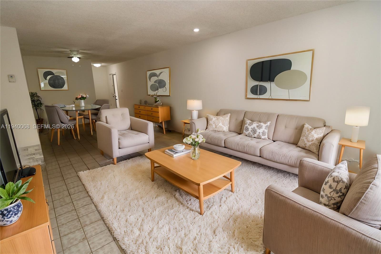 1348 Southwest 2nd Street, Unit 8 Miami, FL 33135 - Photo 3 of 37 a living room with furniture and a rug