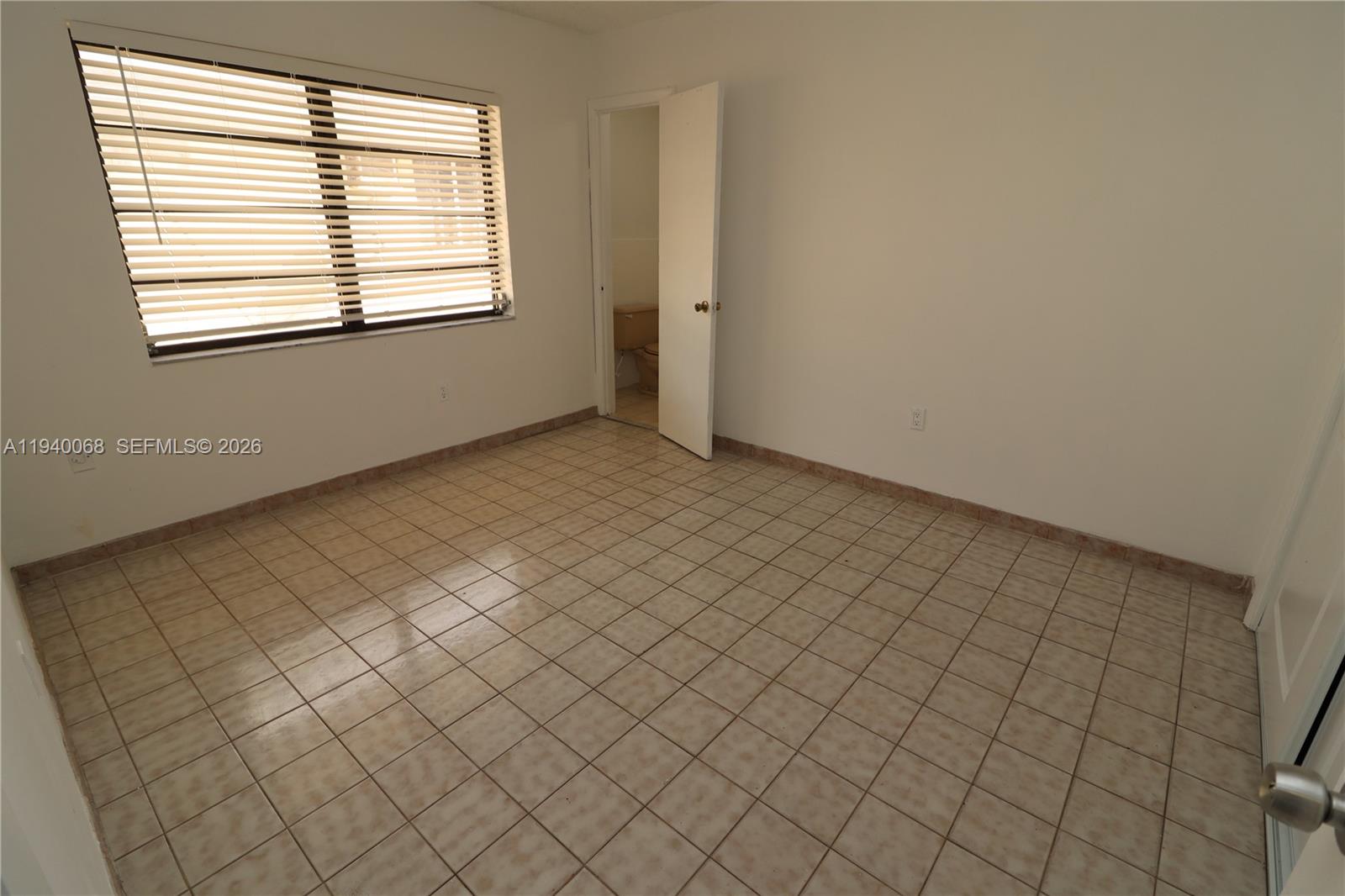 1348 Southwest 2nd Street, Unit 8 Miami, FL 33135 - Photo 31 of 37 an empty room with windows