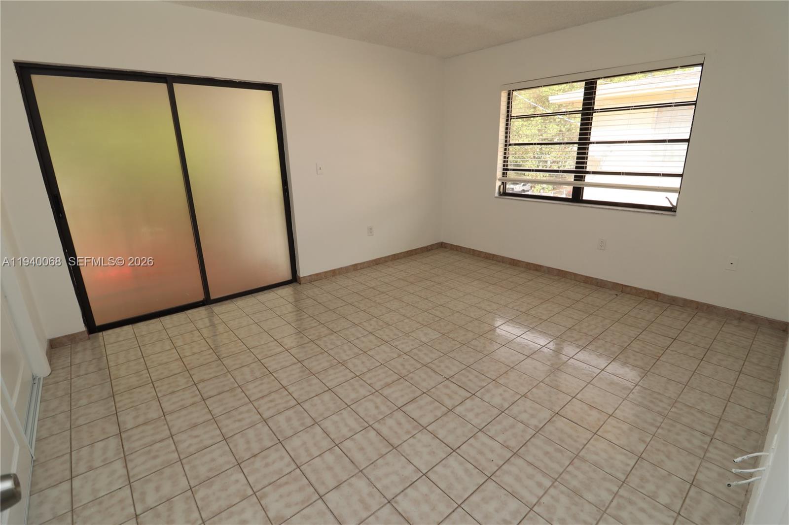 1348 Southwest 2nd Street, Unit 8 Miami, FL 33135 - Photo 35 of 37 an empty room with windows