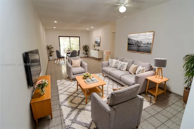 a living room with furniture and a window