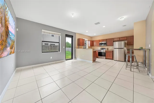 a view of a kitchen with furniture and a stove