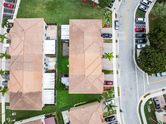 an aerial view of a house with a garden and plants