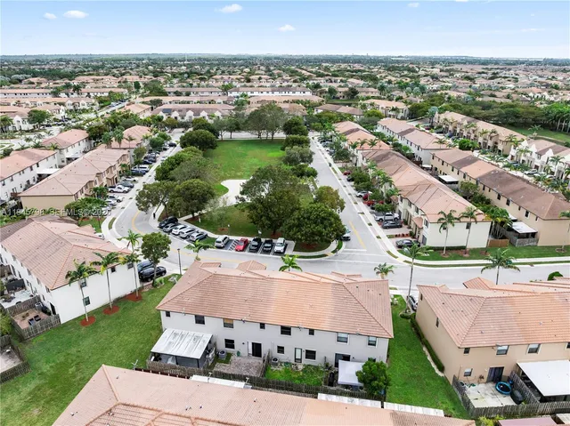 an aerial view of a house with a garden