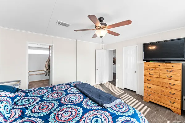 a bedroom with a bed and a tv in it
