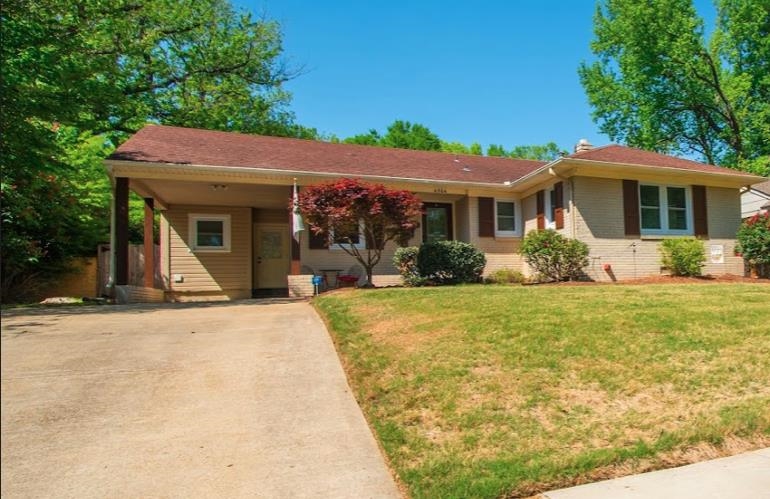 4964 Flamingo Road Memphis, TN 38117 - Photo 1 of 18 a front view of a house with garden
