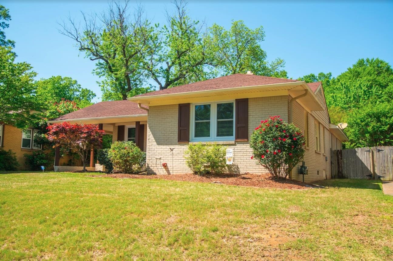 4964 Flamingo Road Memphis, TN 38117 - Photo 3 of 18 a front view of a house with a yard