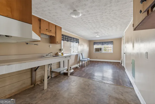 a view of a kitchen with furniture and window