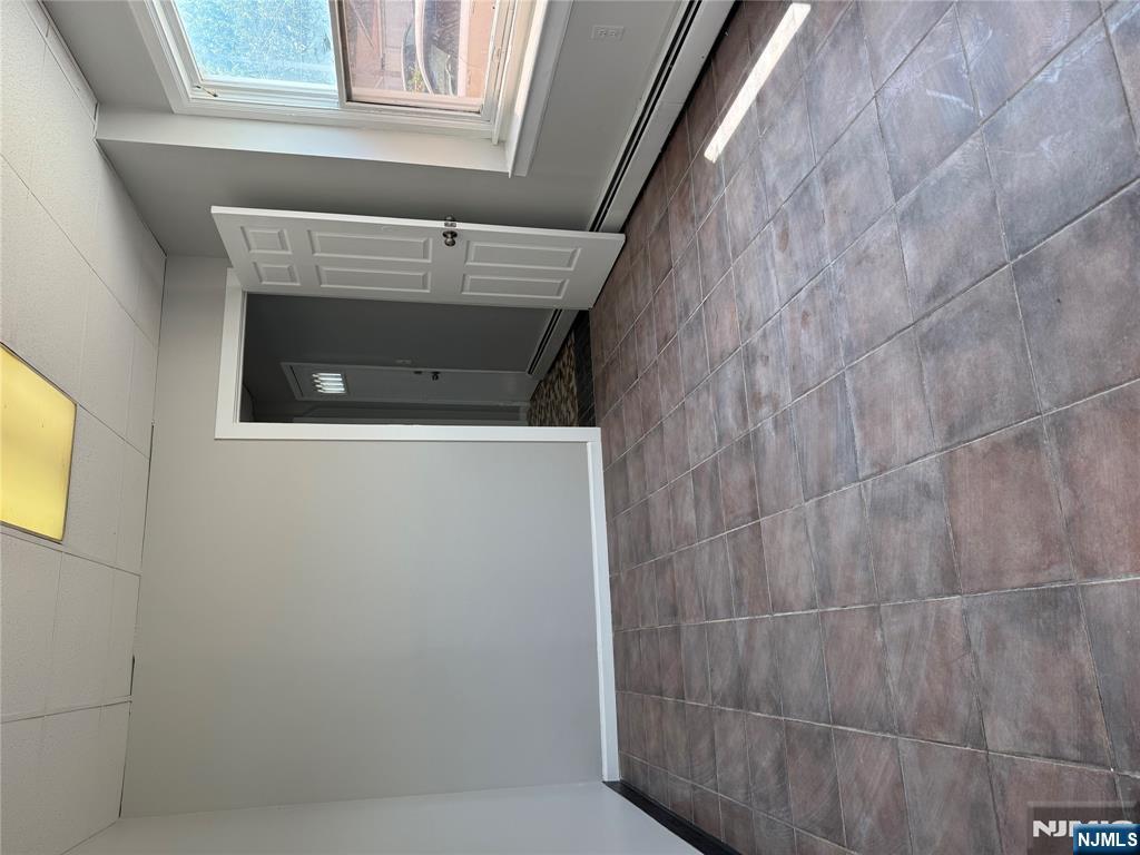 75 Lodi Street Hackensack, NJ 07601 - Photo 4 of 11 a view of an empty room and window