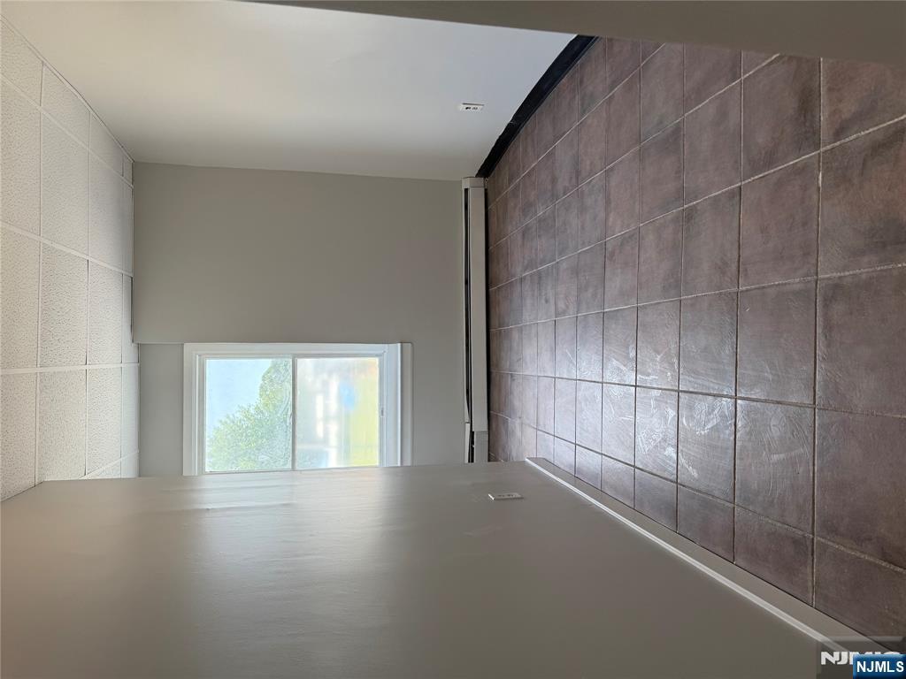 75 Lodi Street Hackensack, NJ 07601 - Photo 5 of 11 a view of an empty room and window