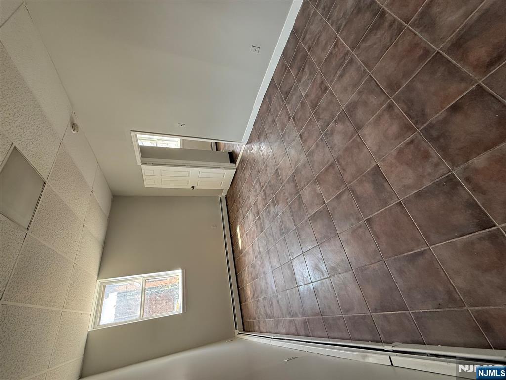 75 Lodi Street Hackensack, NJ 07601 - Photo 10 of 11 a view of an empty room and window