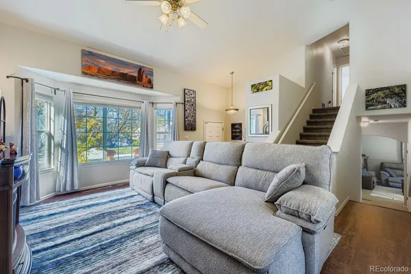 a living room with furniture and a large window