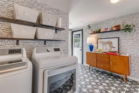 a kitchen with sink stove and cabinets