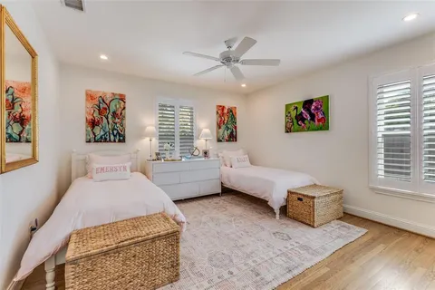 a bedroom with furniture and a window