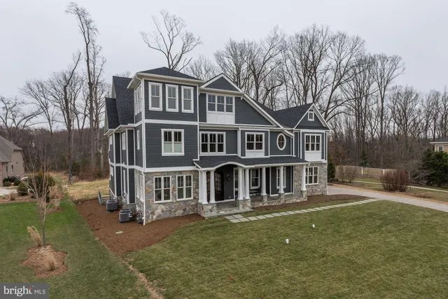 a aerial view of a house with a yard