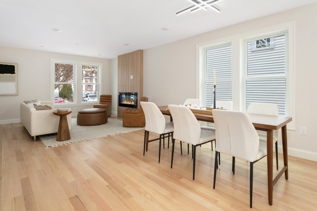 157 Boston Avenue, Unit 1 Somerville, MA 02144 - Photo 16 of 40 a view of a dining room with furniture window and wooden floor