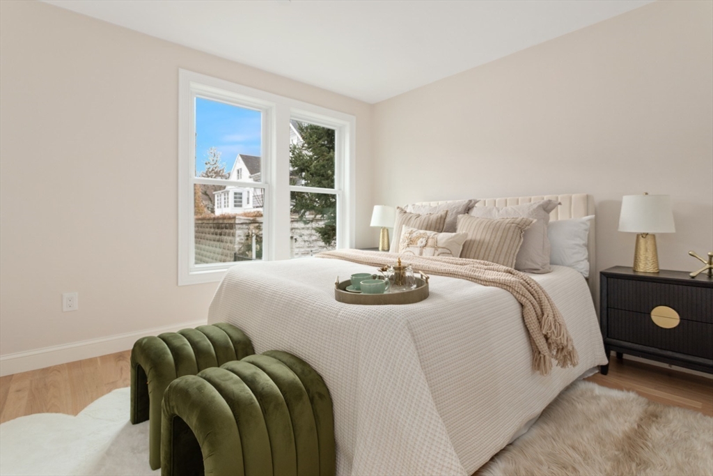 157 Boston Avenue, Unit 1 Somerville, MA 02144 - Photo 17 of 40 a bedroom with bed and a window