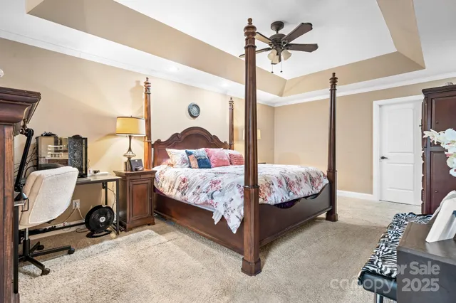 a bedroom with bed and glass door