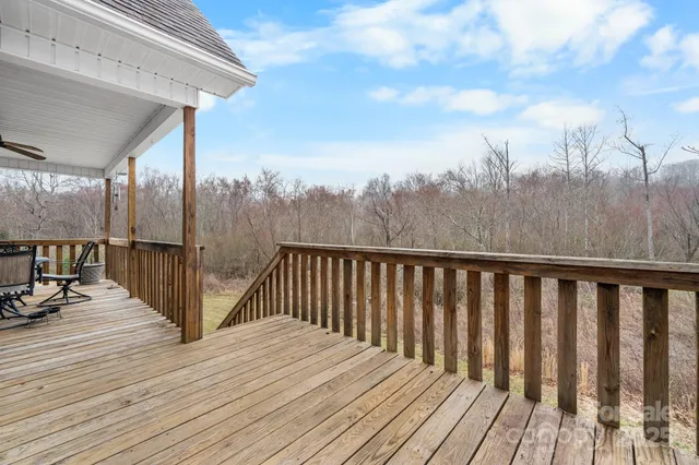a view of balcony with wooden floor