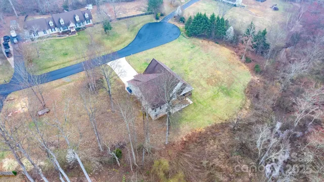 a view of a swimming pool with a yard