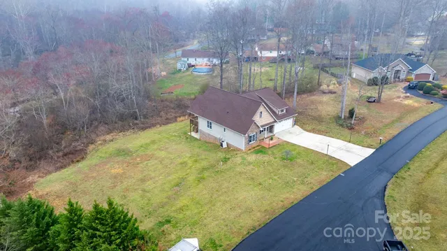 a view of a pool with a yard