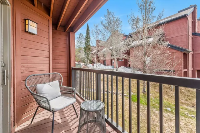a view of a chair and table in the balcony