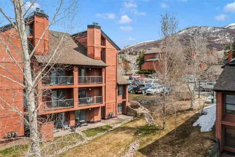 a front view of a building with a yard