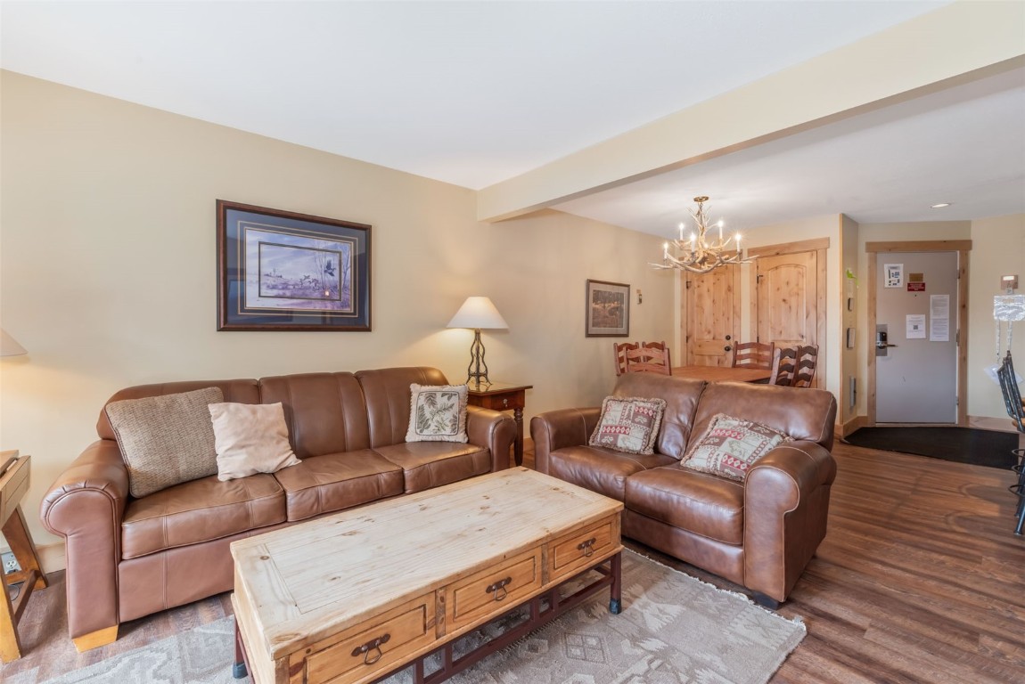2015 Walton Creek Road, Unit 113 Steamboat Springs, CO 80487 - Photo 6 of 33 a living room with furniture and wooden floor