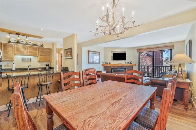 a living room with fireplace furniture and a flat screen tv