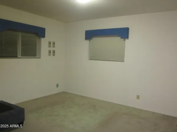 an empty room with a mirror