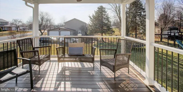 a view of a balcony with chairs