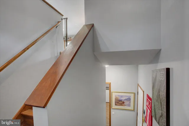a view of a hallway with stairs